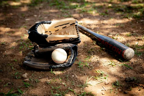 Baseball bat and ball on the ground