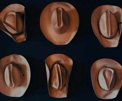Cowboy hats on a wooden table
