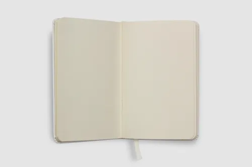 Plain white notebook open on a table