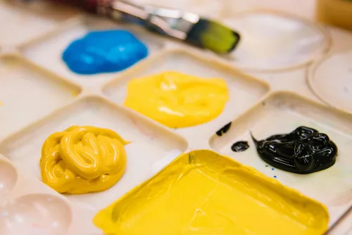 White paint palette with paint on it