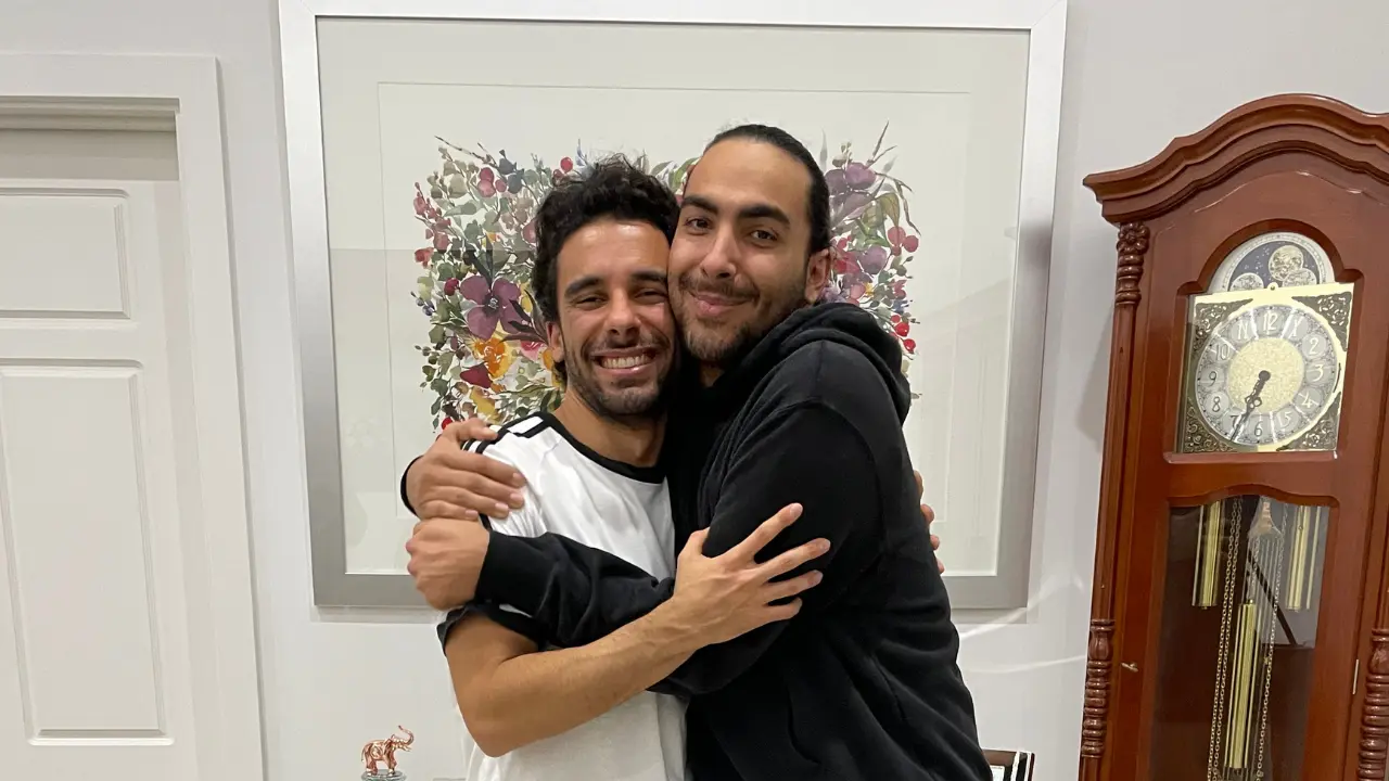 Sav and Dom Tripodi hugging